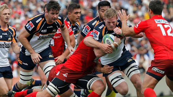Front foot: Tom Cusack storms into the Sunwolves defence.