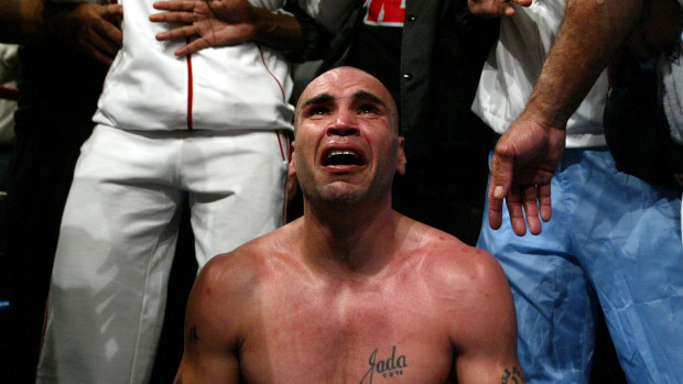 Raw emotion: Mundine breaks down after beating Antwun Echols to claim his first world title in 2003.