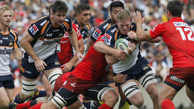 Front foot: Tom Cusack storms into the Sunwolves defence.