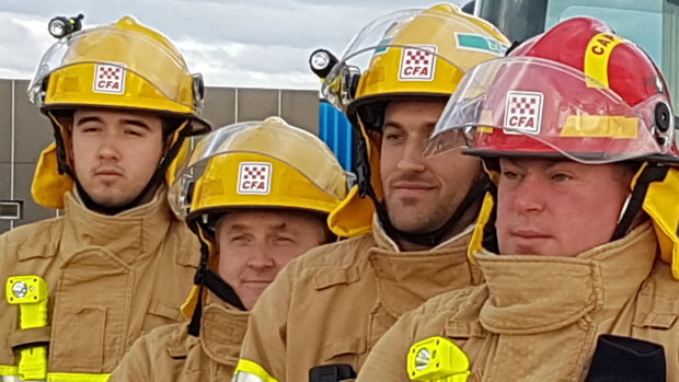 CFA captain Mark Hatton (right) and other crew helped save lives in Orbost. 