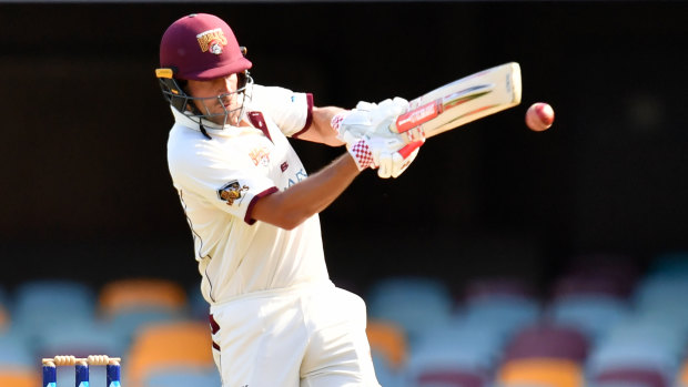 Joe Burns of the Bulls hits a boundary on day three.