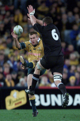 Chris Latham kicks during the 2002 Bledisloe Cup Test in Sydney.