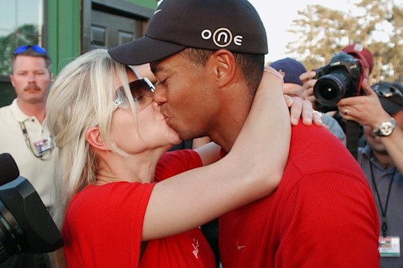 Woods kisses Elin Nordegren after winning the 2005 Masters, a year after their marriage.