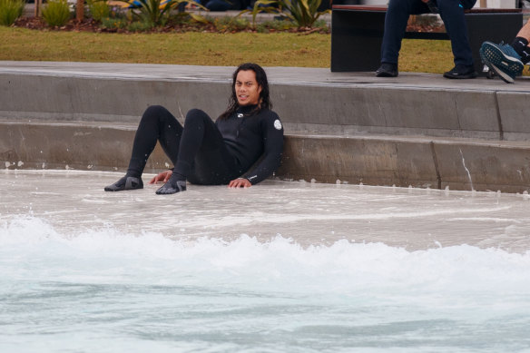 An exhausted Jarome Luai after being pulled out of the water.