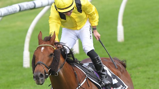 Tom Marquand stands in the irons after winning the Ranvet on Addeybb.