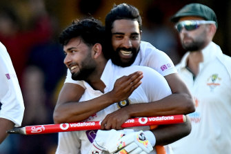 Rishabh Pant is hugged by Mohammed Siraj after India won the series against Australia at the Gabba.
