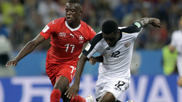 Tough battle: Switzerland's Denis Zakaria, left, and Costa Rica's Joel Campbell fight for the ball.
