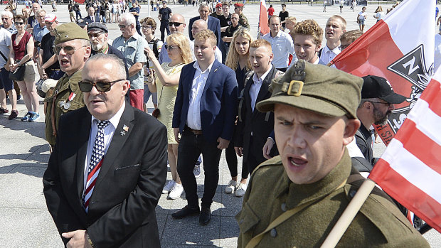 Polish officials and war veterans pay tribute to a World War II-era underground force that collaborated with the Nazi towards the end of World War II.