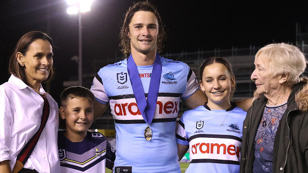 Nicho Hynes with the family of the late Paul Green after Thursday night’s win over the Cowboys.