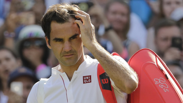 Head scratcher: Roger Federer became a surprise victim of the Wimbledon semi-finals.
