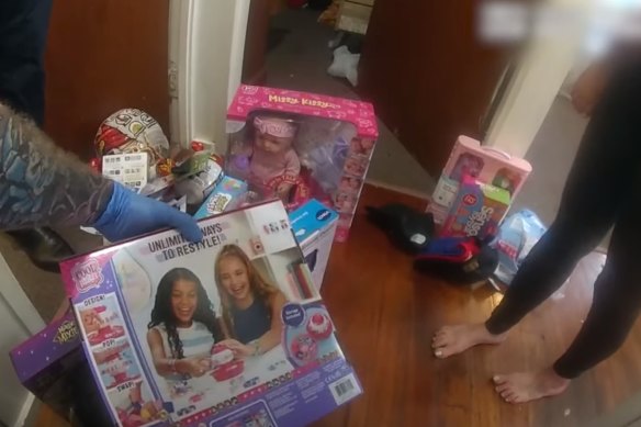 Police shared video of toys being found at the home in Eagleby where the pair were arrested.