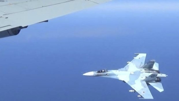 A Russian jet coming within a few feet of a US Air Force reconnaissance jet over the Baltic Sea last year.
