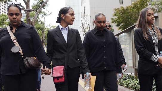 Family members of Australian citizen Donna Nelson head to the Chiba District Court on the opening day of the trial.