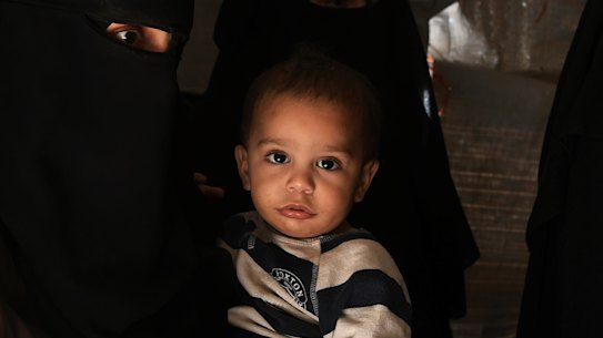 Australian Zahra Ahmed with her son Ibrahim in the al-Hawl camp in north-east Syria in 2019. 