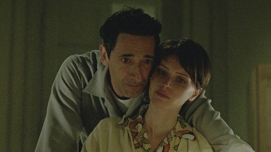 This image released by A24 shows Adrien Brody, left, and Felicity Jones in a scene from "The Brutalist." (A24 via AP)