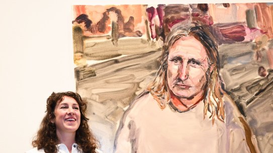 Laura Jones with her portrait of Tim Winton.