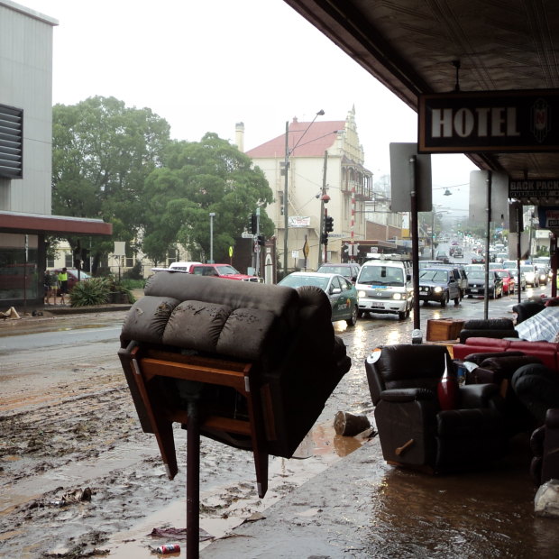 An armchair sits impaled on a parking meter opposite Rowes in Russell Street the day after the January 10 floodwaters rushed through the regional city in 2011.