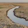 Residents prepare to travel into marshlands near Chibayish, Iraq. As water levels fall, the once verdant wetlands that formed a massive, shallow, reed-filled inland sea have been reduced to a thinning network of brackish canals.