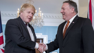 US Secretary of State Mike Pompeo shakes hands with UK Foreign Secretary Boris Johnson in Washington.