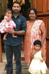 Priya and Nades with their daughters.