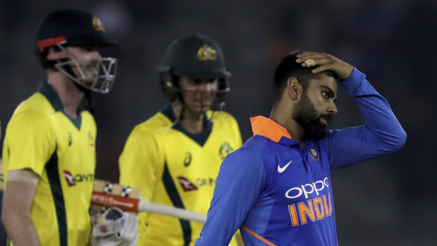 Circumspect: Indian skipper Virat Kohli (right) is more concerned with the World Cup than the series loss to Australia.