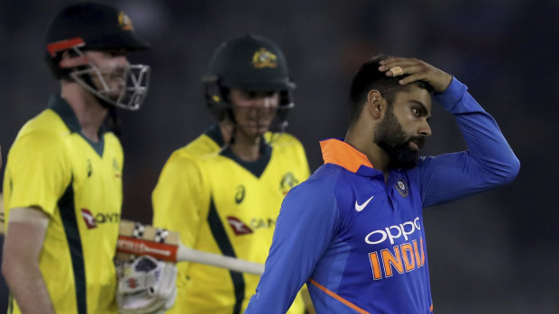 Indian skipper Virat Kohli (right) comes to terms with a loss to Australia last year.