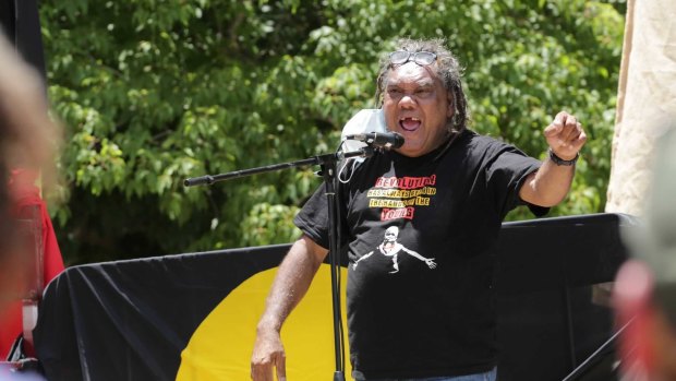 Wayne Wharton addresses the crowd at the Invasion Day rally in Brisbane