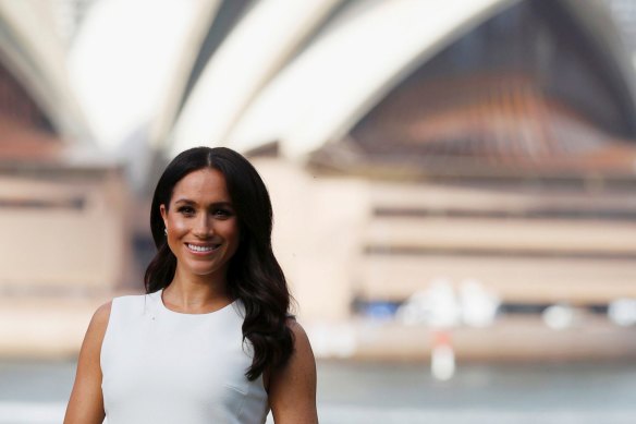 Meghan poses outside the Sydney Opera House during the royal tour. 