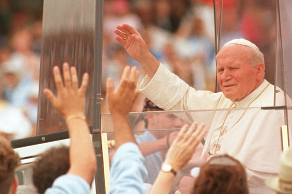 Pope John Paul II, pictured during a 1995 visit to Australia, wrote in an early poem: “I knew the light that lingered in ordinary things/Like a spark sheltered under the skin of our days.”