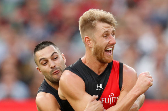 Dyson Heppell is tackled by Michael Gibbons.