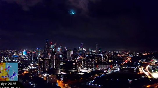 The bright flash of a meteor falling to earth above the Brisbane city skyline on the evening of April 21, 2025.