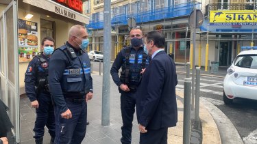 Christian Estrosi, the mayor of Nice, speaks to police at the scene of the attack.