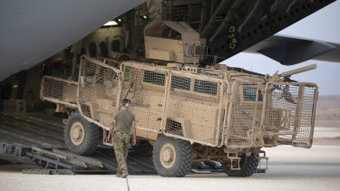 A US vehicle is loaded onto a cargo plane at the Kobani Landing Zone on its way out of Syria last week. 