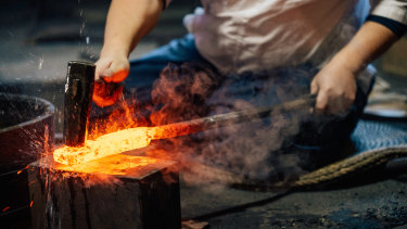 Swordsmith Yuya Nakanishi of Kameoka City hard at work.