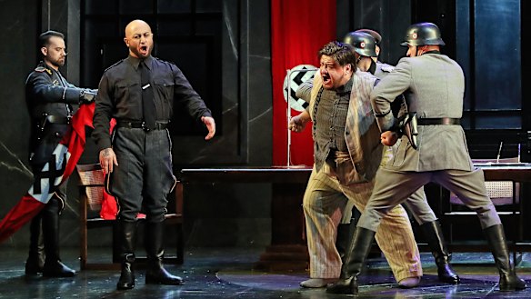 Marco Vratogna as Scarpia and Diego Torre as Cavaradossi in the climactic torture scene.