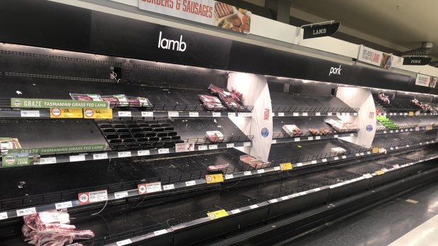 Regional supermarkets, like this Coles in Gisborne, are being cleared of supplies by desperate city-based shoppers.