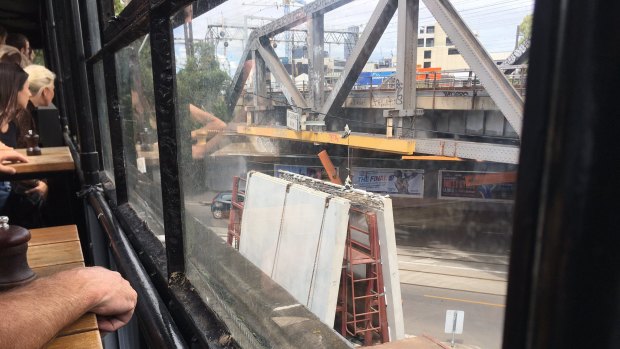 Traffic, trains and trams in Richmond were disrupted on Friday after a truck hit the rail bridge on Swan Street.