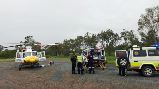 The RACQ CQ Rescue helicopter was forced to land at the Ilbilbie roadhouse, about 20 kilometres from the scene, due to poor weather.