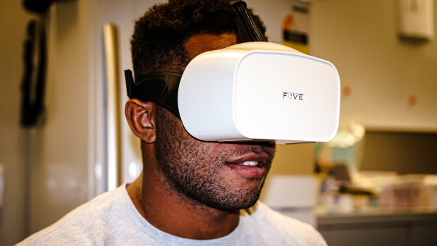 Queensland Reds winger Filipo Daugunu trials the new eye-tracking virtual reality technology. 