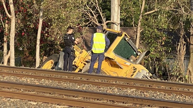 The front-end loader crashed through a rail corridor in Ipswich, south-west of Brisbane, damaging rail infrastructure.