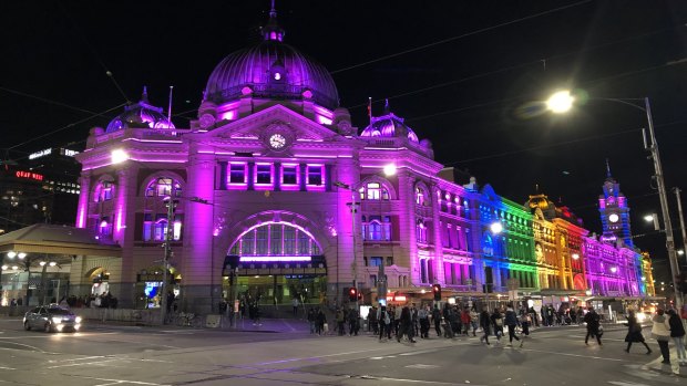 Flinders St lit up in rainbow colours during last year's Wear it Purple day.