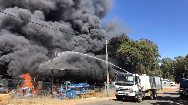 Emergency crews are battling a fire at a cold storage shed in Karragullen. 
