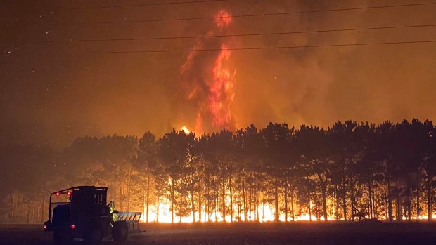 Volunteer firefighter Nikki Woods captured how tall the flames reached in Gingin on Tuesday night. 