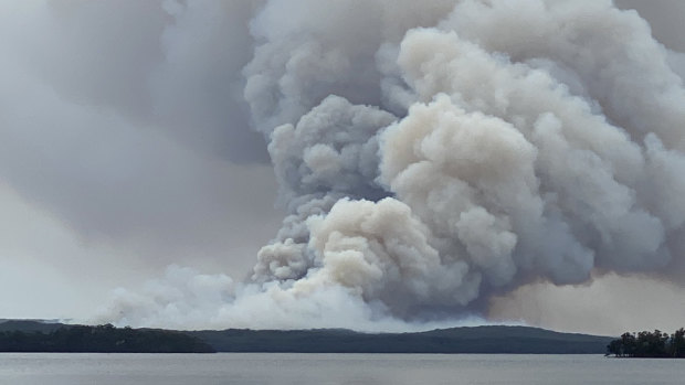 Photo taken west of the fire from St George’s Basin looking east towards Booderee National Park. 