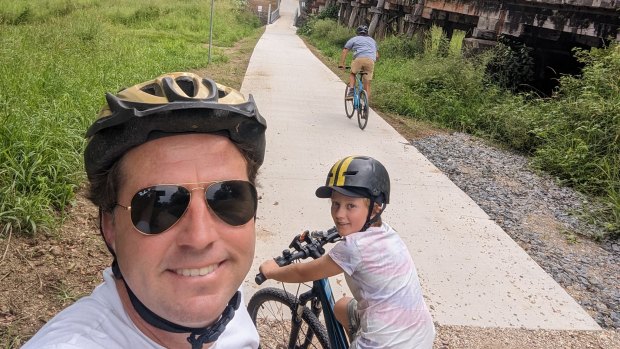 Byron councillor Asren Pugh rides the Tweed rail trail with his family.