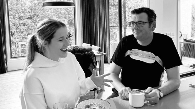 Mr Andrews pictured at home wearing a spinal brace with his daughter.