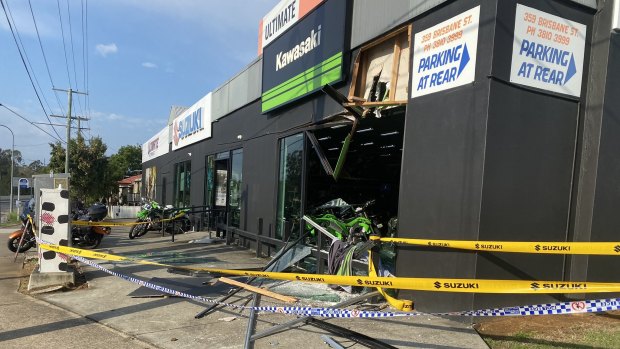 The front-end loader was initially used to ram raid a motorbike shop, police said.