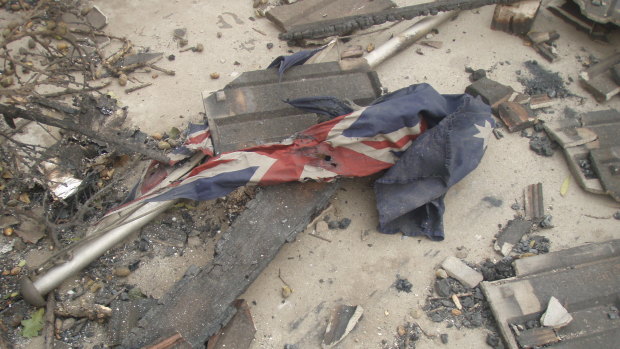 The flag as Sergeant Kevin Graham found it in the ruins of Marysville police station.