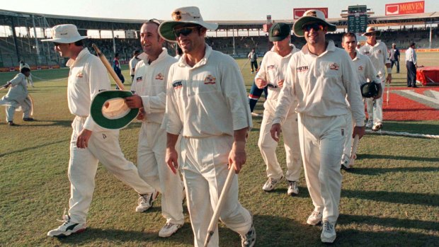 Australian cricketers walk from the field after drawing the third Test against Pakistan in Karachi, 1998.