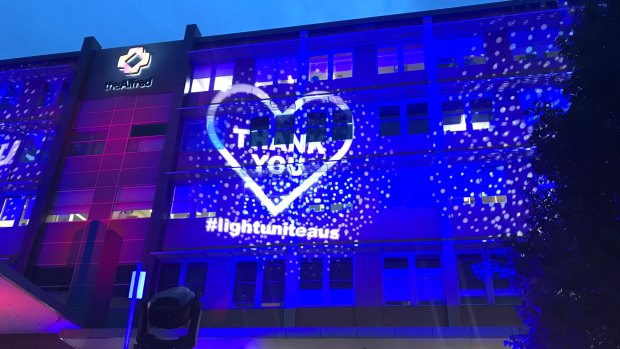 The Alfred is lit up with messages of support for health workers on Wednesday night.